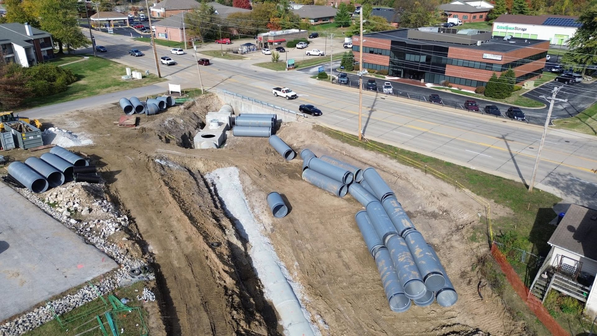 Aerial view of water and sewer pipe installation in a trench